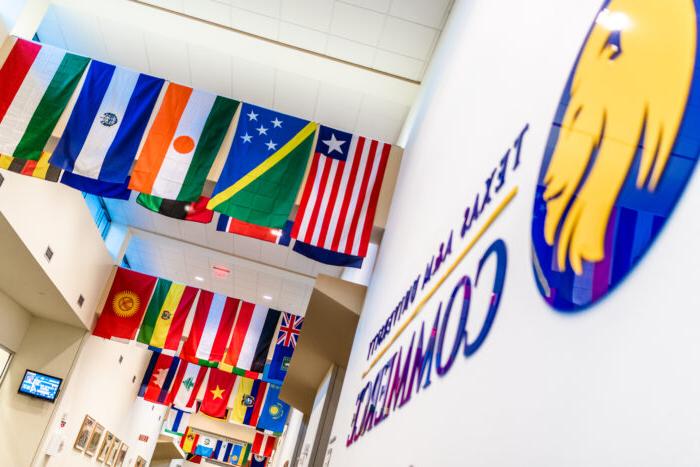 International flags being displayed with A&M-Commerce signature on the left side.